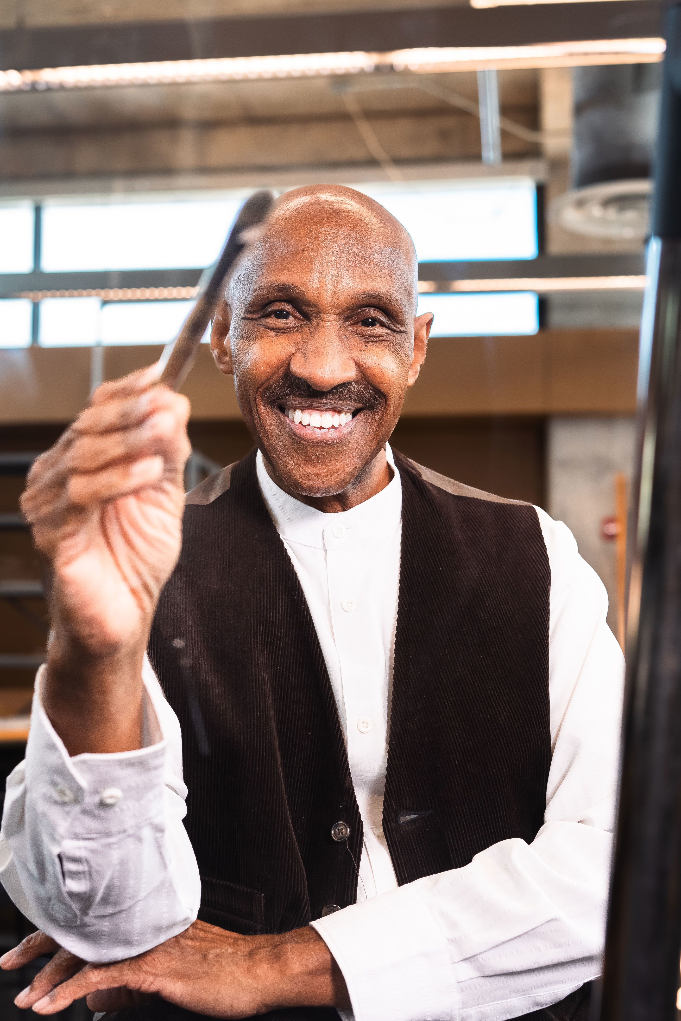 Dr. Clarence Talley with a paintbrush