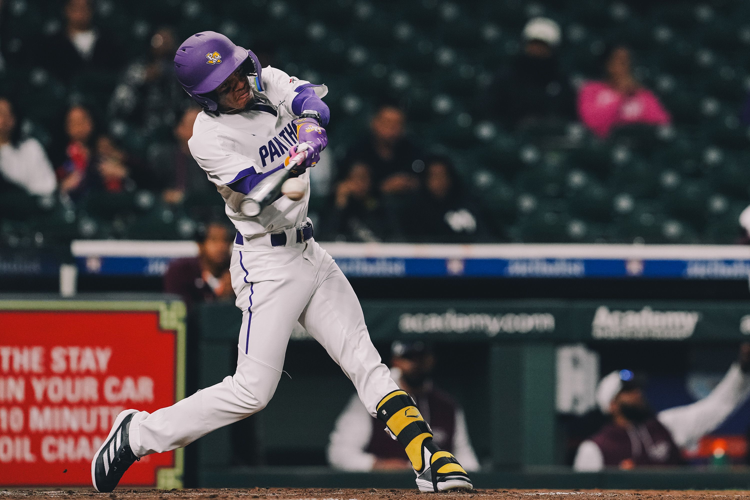 Baseball Player Swinging Bat